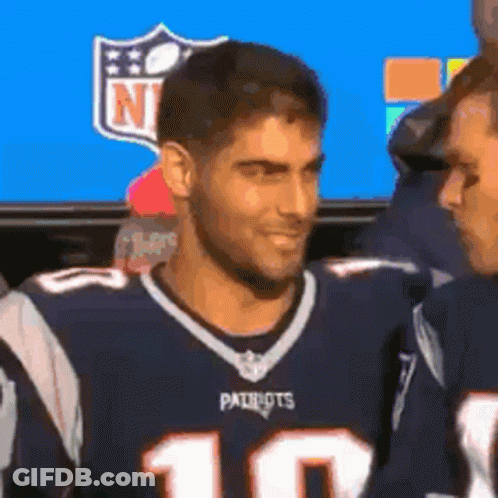 Man In Patriots Jersey Standing Next To Another Man GIF