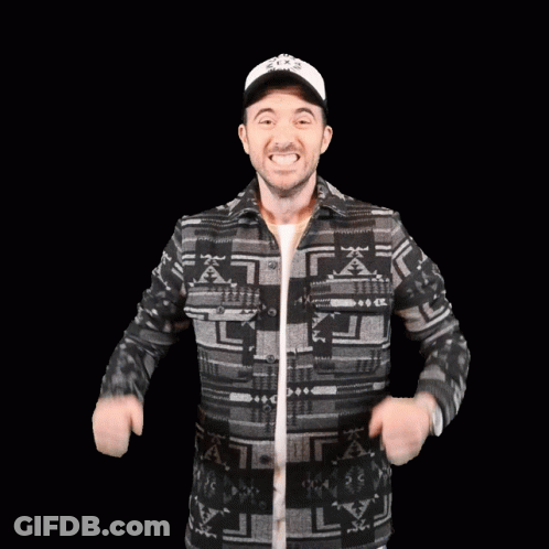 Man In Patterned Shirt And Hat Flexing Muscles GIF