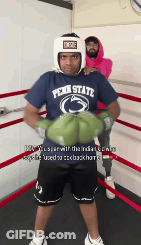 Man In Penn State Shirt And Boxing Gloves GIF