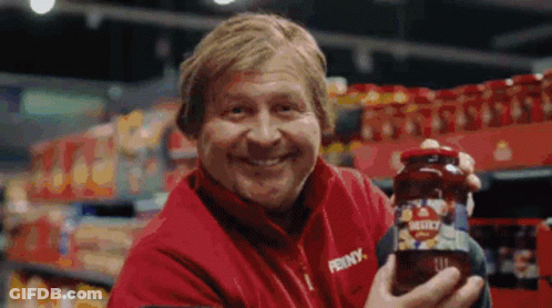 Man In Penny Jacket Holding Jar GIF