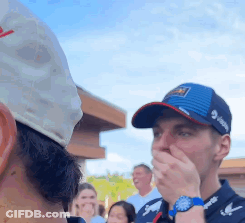 Man In Pepsi Hat Covering Mouth GIF