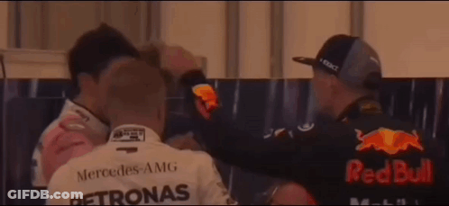 Man In Petronas Shirt Hugging Man In Red Bull Shirt GIF