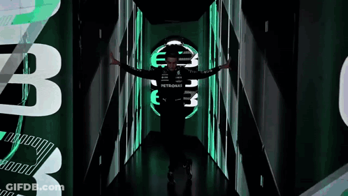 Man In Petronas Shirt Standing In Dark Tunnel GIF