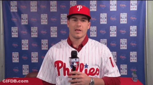 Man In Phillies Jersey Holding Microphone GIF