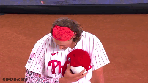 Man In Phillies Jersey Holding Stuffed Animal GIF