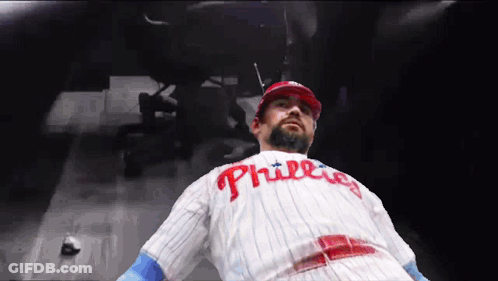 Man In Phillies Jersey Laying Down GIF