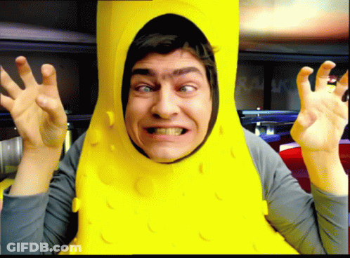 Man In Pickle Costume Making A Face GIF