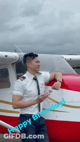 Man In Pilot Uniform Leaning Against Airplane Saying Happy Birthday GIF