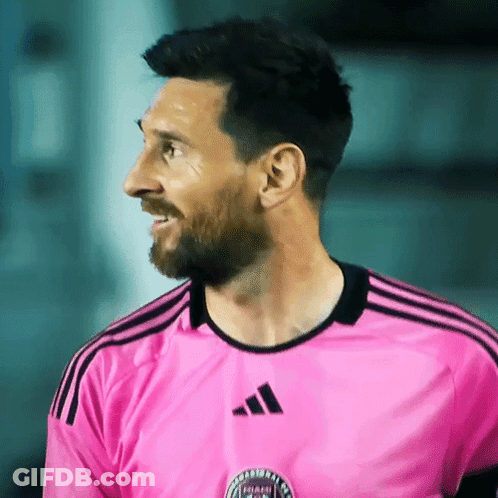 Man In Pink Adidas Shirt Smiles GIF