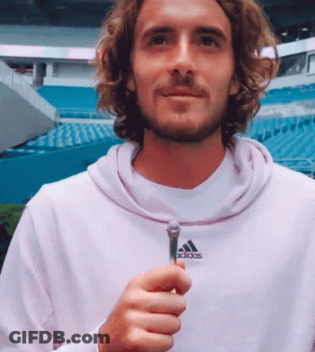 Man In Pink Adidas Sweatshirt Holding Microphone GIF