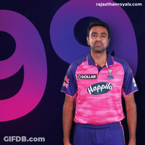 Man In Pink And Blue Shirt With Dollar Logo GIF