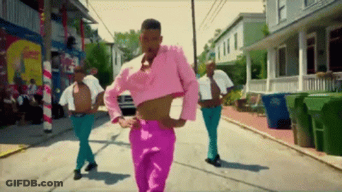 Man In Pink Crop Top Walking Down Street GIF