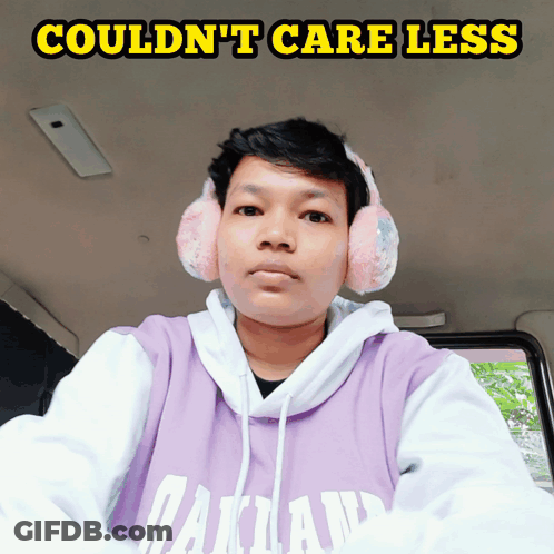 Man In Pink Ear Muffs And Purple Hoodie Couldn't Care Less GIF