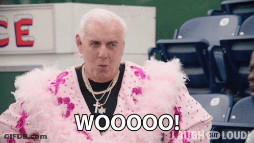 Man In Pink Feathered Outfit Saying Woooo GIF