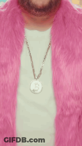 Man In Pink Fur Coat And Dollar Sign Necklace GIF