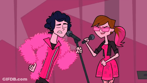 Man In Pink Fur Coat Singing With Woman In Pink Dress GIF