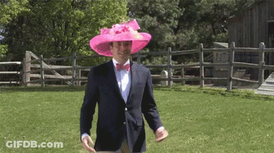 Man In Pink Hat And Bow Tie Walking GIF