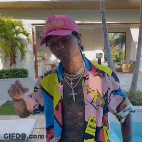Man In Pink Hat And Colorful Shirt By Pool GIF