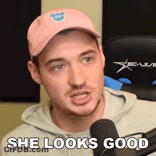 Man In Pink Hat And Hoodie Says She Looks Good GIF