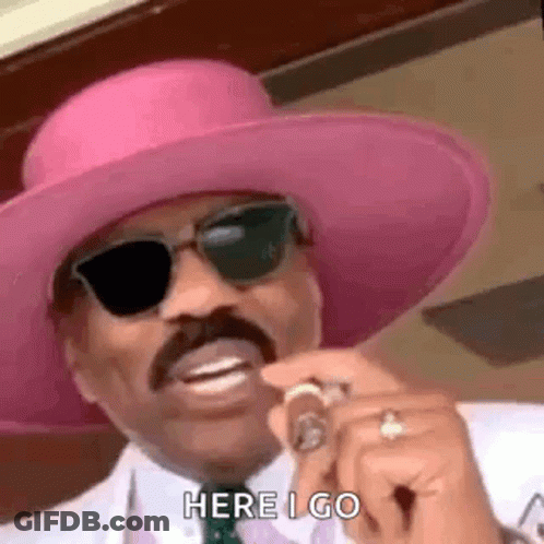 Man In Pink Hat And Sunglasses Holding Cigar GIF