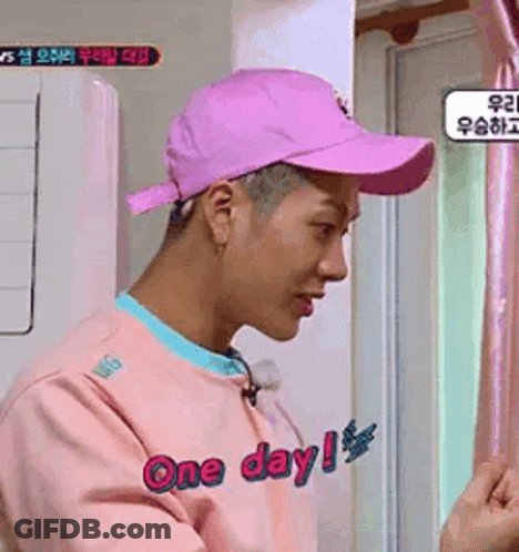 Man In Pink Hat, Pink Sweater By Window GIF