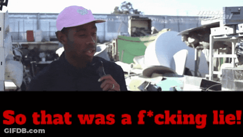 Man In Pink Hat Talking Into Microphone Saying So That Was A F*cking Lie GIF