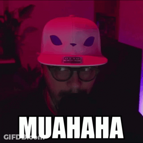 Man In Pink Hat With Cat Face Saying Muahaha GIF