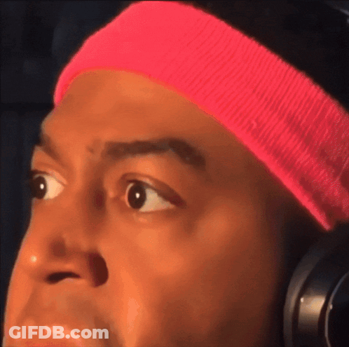 Man In Pink Headband And Headphones Looks Surprised GIF