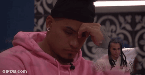 Man In Pink Hoodie Hand On Face GIF