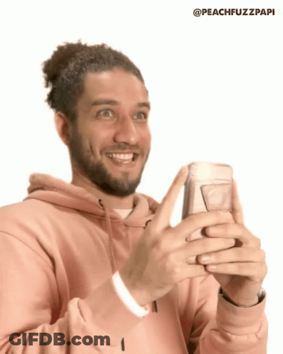 Man In Pink Hoodie Holding Cell Phone GIF