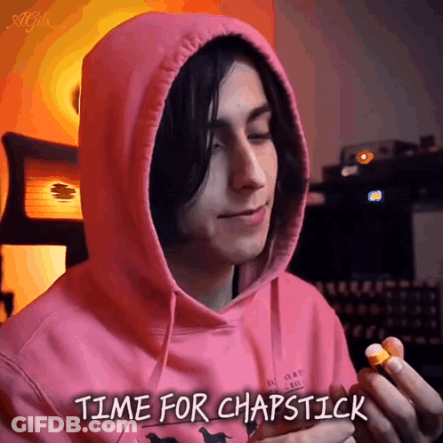 Man In Pink Hoodie Holding Lip Balm Saying Time For Chapstick GIF