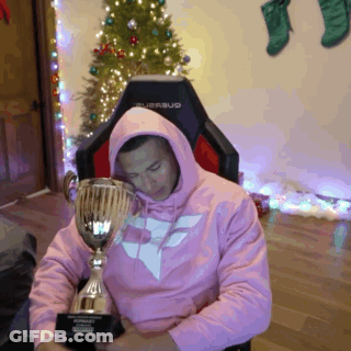 Man In Pink Hoodie Holding Trophy GIF