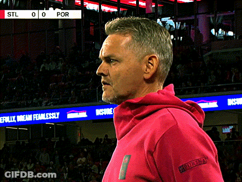 Man In Pink Hoodie In Front Of Scoreboard STL 0-0 POR GIF