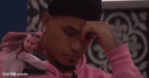Man In Pink Hoodie Touching Forehead Hugged By Woman GIF