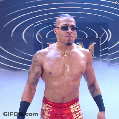 Man In Pink Jacket And Blue Shorts Before Banner Saying Next North American Champion GIF
