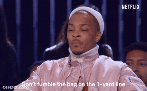 Man In Pink Jacket And White Hat Saying Don't Fumble The Bag On The 1 Yard Line GIF