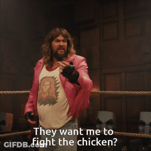 Man In Pink Jacket Boxing Chicken GIF