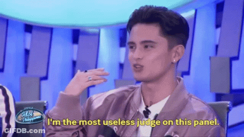 Man In Pink Jacket Saying Useless Judge GIF