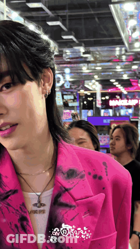 Man In Pink Jacket With Viktor Necklace GIF