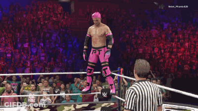 Man In Pink Jumping In Wrestling Ring GIF