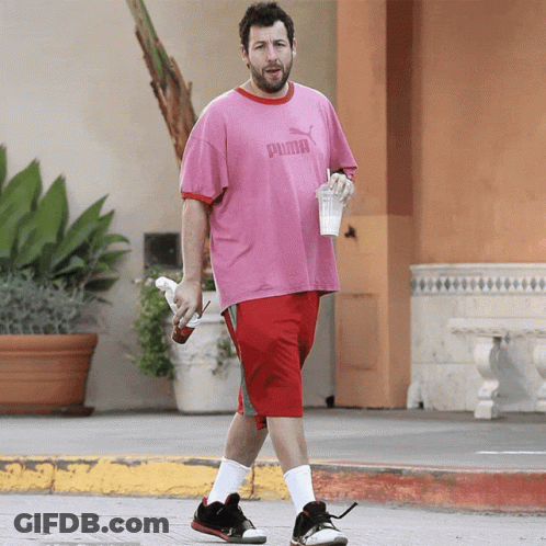 Man In Pink Puma Shirt And Red Shorts Walking GIF