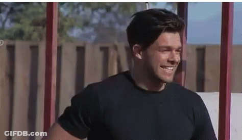 Man In Pink Puma Shirt, Red Shorts Walking GIF