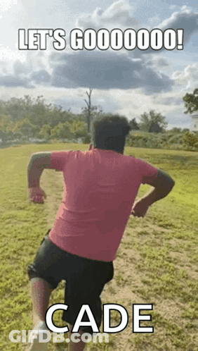Man In Pink Shirt And Black Shorts Running GIF