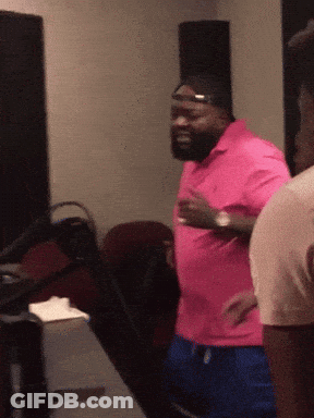 Man In Pink Shirt And Blue Shorts GIF