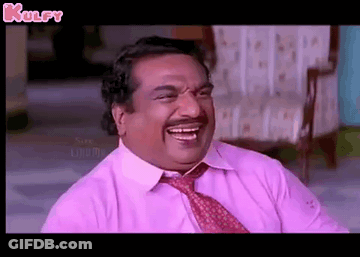 Man In Pink Shirt And Tie Laughing On Chair GIF