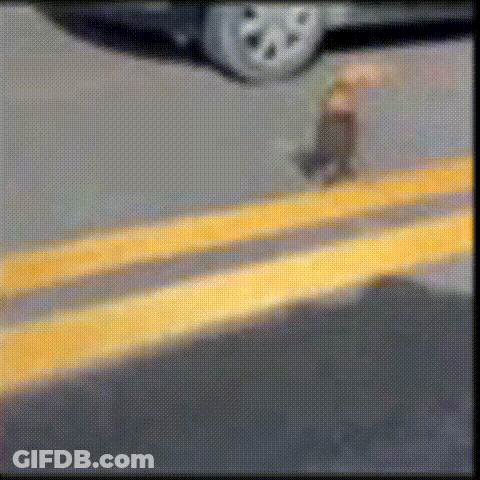 Man In Pink Shirt And Woman In Plaid Playing Tennis GIF