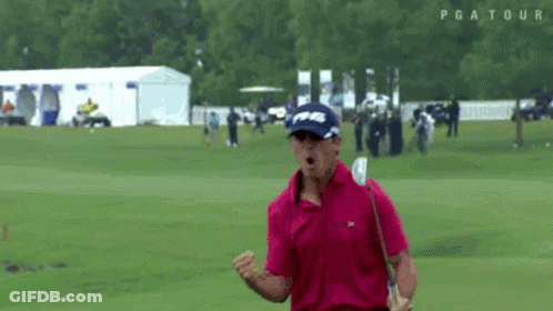 Man In Pink Shirt Celebrating With Golf Club GIF