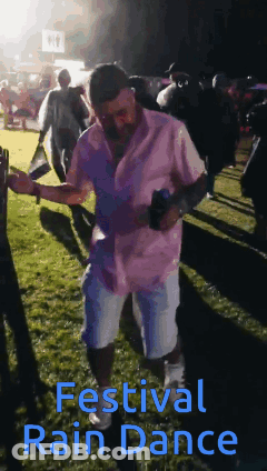 Man In Pink Shirt Dancing At Festival GIF