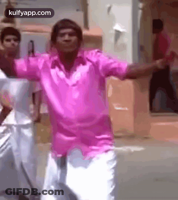 Man In Pink Shirt Dancing With Arms Outstretched GIF