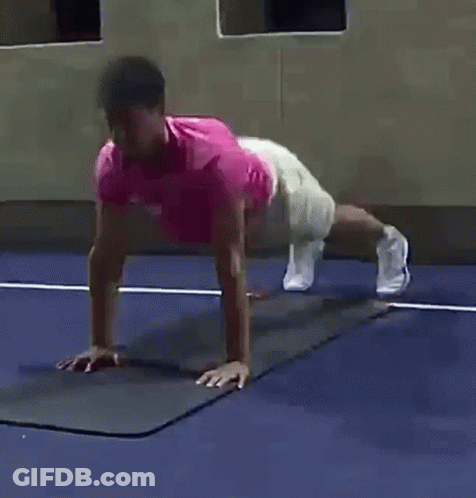 Man In Pink Shirt Doing Push Ups GIF